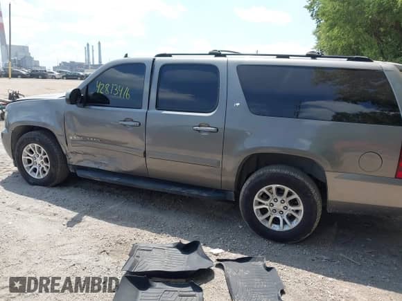 2007 Chevrolet Suburban LT with VIN 1GNFC16087J214521, listed as a IAAI auction lot 42813416 with 207,126 mi miles and . Bid and sale history available at DreamBid. Image 14.