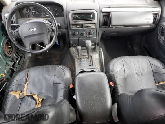 2002 Jeep Grand Cherokee Laredo with VIN 1J8GW48S82C159112, listed as a Copart auction lot 84000665 with 204,396 mi miles and Salvage title. Bid and sale history available at DreamBid. Image 8.