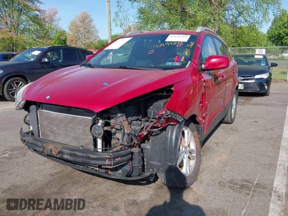 2011 Hyundai Tucson Limited with VIN KM8JUCAC4BU143656, listed as a IAAI auction lot 42144244 with 128,470 mi miles and . Bid and sale history available at DreamBid. Image 2.