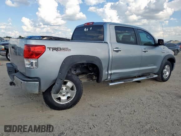 2013 Toyota Tundra Platinum с VIN 5TFFY5F10DX145553, выставлен на аукционе Copart как лот 82311405 с пробегом 142 592 миль миль и Списание • Salvage title. История ставок и продаж доступна на DreamBid. Изображение 3.