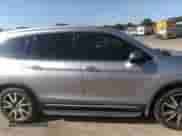 2021 Honda Pilot Touring 7-Passenger with VIN 5FNYF5H69MB000710, listed as a IAAI auction lot 43081838 with 91,899 mi miles and . Bid and sale history available at DreamBid. Image 13.