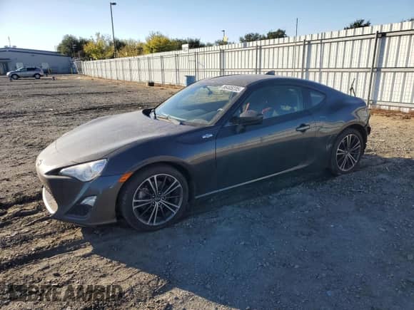 2016 Scion FR-S z VIN JF1ZNAA18G9709793, wystawiony jako Copart lot #86405235 z przebiegiem 57 822 mil mil oraz Szkoda całkowita • Salvage title. Historia ofert i sprzedaży dostępna na DreamBid. Obrazek 1.