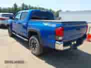 2018 Toyota Tacoma SR z VIN 3TMCZ5AN0JM126724, wystawiony jako IAAI lot #42842788 z przebiegiem 91 776 mil mil oraz . Historia ofert i sprzedaży dostępna na DreamBid. Obrazek 3.