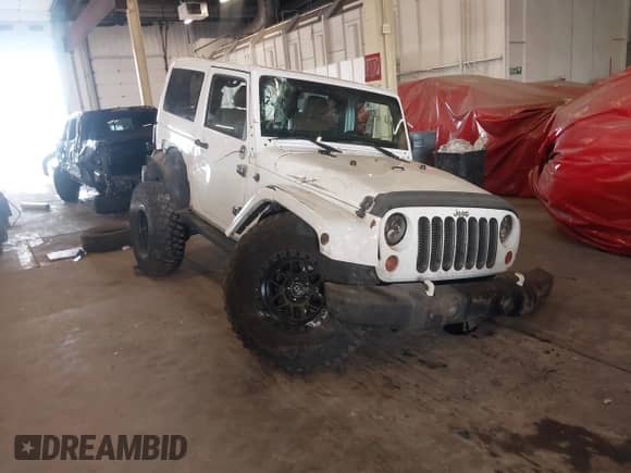 2012 Jeep Wrangler Arctic with VIN 1C4AJWBG9CL233232, listed as a IAAI auction lot 42282805 with 109,927 mi miles and . Bid and sale history available at DreamBid. Image 1.