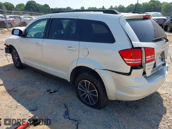 2018 Dodge Journey SE with VIN 3C4PDCABXJT448934, listed as a IAAI auction lot 42614601 with Not provided miles and . Bid and sale history available at DreamBid. Image 3.