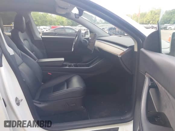 2020 Tesla Model Y Long Range with VIN 5YJYGDEE1LF012853, listed as a IAAI auction lot 42289499 with 99,236 mi miles and . Bid and sale history available at DreamBid. Image 5.