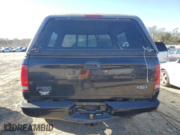 2002 Ford F-150 XL z VIN 1FTRF18232NA58109, wystawiony jako Copart lot #79080674 z przebiegiem 148 213 mil mil oraz Szkoda całkowita • Salvage title. Historia ofert i sprzedaży dostępna na DreamBid. Obrazek 6.