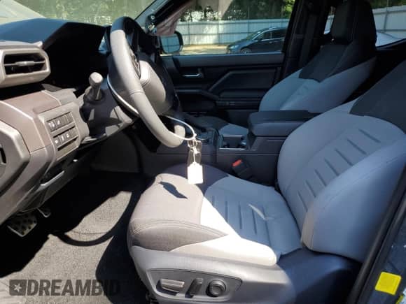 2025 Toyota Tacoma SR5 with VIN 3TMKB5FN4SM030413, listed as a Copart auction lot 69246415 with 2,871 mi miles and Salvage title. Bid and sale history available at DreamBid. Image 7.