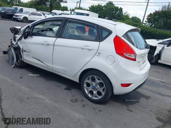 2012 Ford Fiesta SES with VIN 3FADP4FJ5CM183357, listed as a IAAI auction lot 42798122 with 147,657 mi miles and . Bid and sale history available at DreamBid. Image 3.