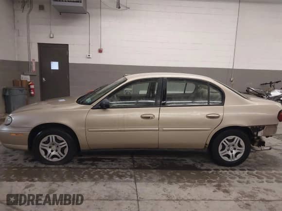 2005 Chevrolet Malibu Classic z VIN 1G1ND52F25M126197, wystawiony jako IAAI lot #41635127 z przebiegiem 218 168 mil mil oraz . Historia ofert i sprzedaży dostępna na DreamBid. Obrazek 15.