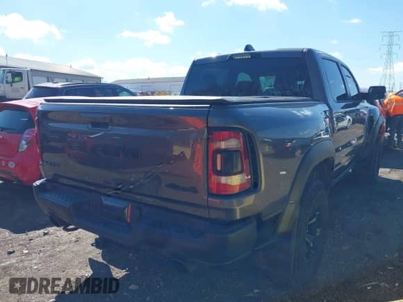 2022 Ram 1500 TRX with VIN 1C6SRFU99NN311731, listed as a IAAI auction lot 41857579 with 20,627 mi miles and . Bid and sale history available at DreamBid. Image 4.