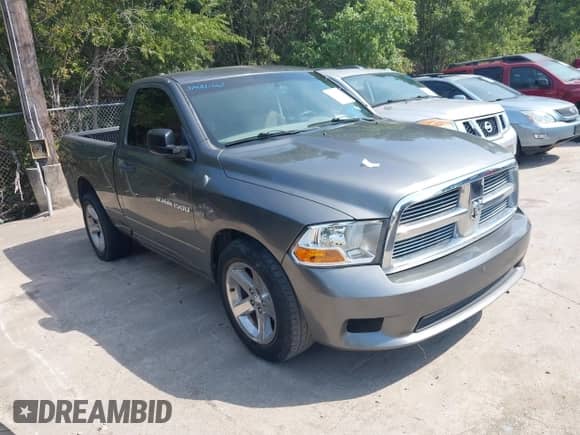 2012 Ram 1500 Express с VIN 3C6JD6AT1CG255526, выставлен на аукционе IAAI как лот 43032556 с пробегом 117 974 миль миль и . История ставок и продаж доступна на DreamBid. Изображение 1.