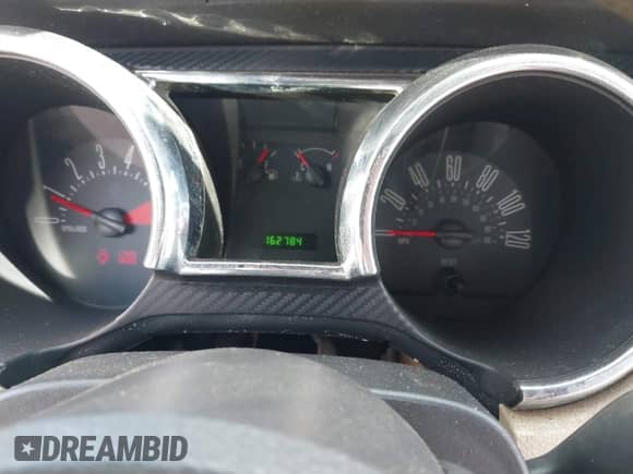 2005 Ford Mustang Deluxe с VIN 1ZVFT84N855231273, выставлен на аукционе IAAI как лот 43504723 с пробегом 162 784 миль миль и . История ставок и продаж доступна на DreamBid. Изображение 7.