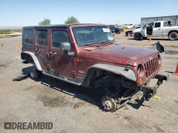 2007 Jeep Wrangler Unlimited Sahara z VIN 1J4GA59157L122909, wystawiony jako Copart lot #67484885 z przebiegiem Nie podano mil oraz Szkoda całkowita • Salvage title. Historia ofert i sprzedaży dostępna na DreamBid. Obrazek 4.