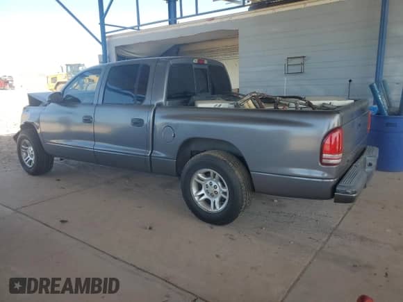 2001 Dodge Dakota Sport with VIN 1B7HL2AN21S298590, listed as a Copart auction lot 54430385 with 175,365 mi miles and Salvage title. Bid and sale history available at DreamBid. Image 2.