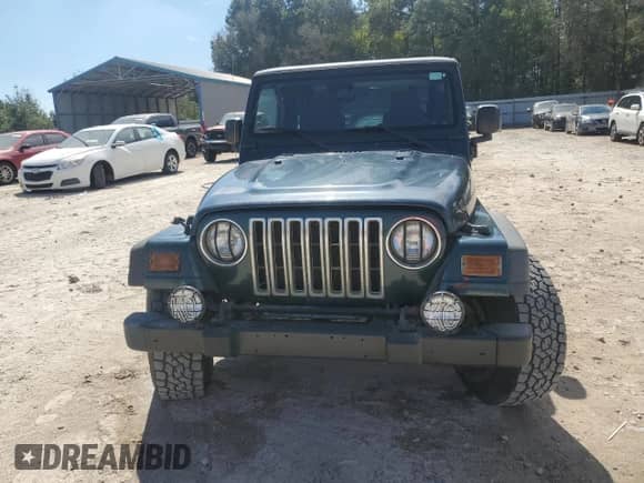 2005 Jeep Wrangler X z VIN 1J4FA39S65P325984, wystawiony jako Copart lot #84242945 z przebiegiem 103 045 mil mil oraz Szkoda całkowita • Salvage title. Historia ofert i sprzedaży dostępna na DreamBid. Obrazek 5.
