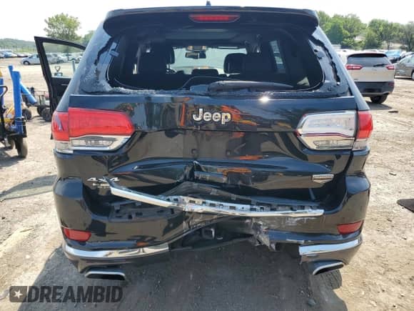 2014 Jeep Grand Cherokee Summit with VIN 1C4RJFJT4EC508994, listed as a Copart auction lot 66526655 with 107,657 mi miles and Salvage title. Bid and sale history available at DreamBid. Image 6.