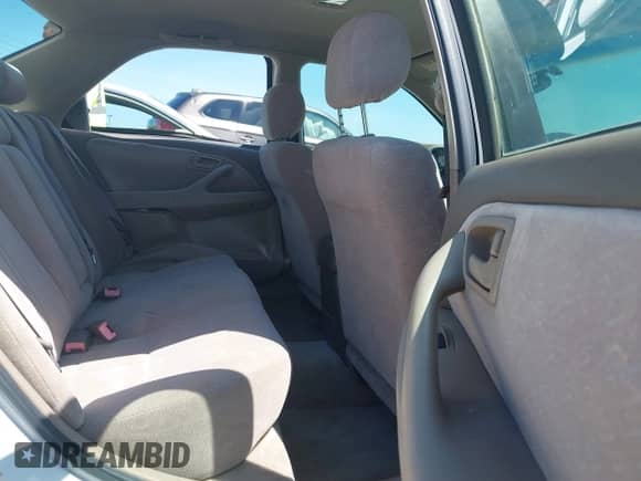 1997 Toyota Camry LE z VIN JT2BF22K6V0052184, wystawiony jako IAAI lot #42608245 z przebiegiem 188 191 mil mil oraz . Historia ofert i sprzedaży dostępna na DreamBid. Obrazek 8.