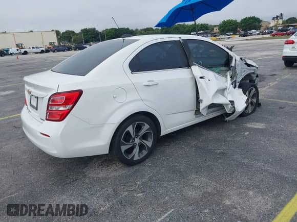 2018 Chevrolet Sonic Premier z VIN 1G1JF5SB3J4106945, wystawiony jako IAAI lot #43090914 z przebiegiem 116 456 mil mil oraz . Historia ofert i sprzedaży dostępna na DreamBid. Obrazek 4.