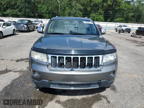 2012 Jeep Grand Cherokee Limited z VIN 1C4RJEBG7CC276299, wystawiony jako Copart lot #64085755 z przebiegiem 86 272 mil mil oraz Szkoda całkowita • Salvage title. Historia ofert i sprzedaży dostępna na DreamBid. Obrazek 5.