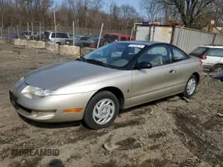 1998 Saturn SC with VIN 1G8ZE1289WZ126065, listed as a Copart auction lot 47439275 with 96,621 mi miles and Salvage title. Bid and sale history available at DreamBid. Image 1.