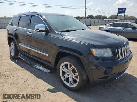 2012 Jeep Grand Cherokee Overland with VIN 1C4RJECG4CC354505, listed as a Copart auction lot 81052135 with 126,523 mi miles and Salvage title. Bid and sale history available at DreamBid. Image 4.