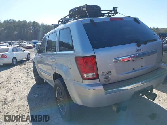 2009 Jeep Grand Cherokee with VIN 1J8HR68T39C540795, listed as a IAAI auction lot 41379112 with 236,624 mi miles and . Bid and sale history available at DreamBid. Image 3.