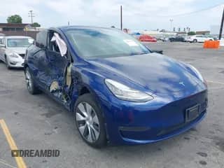 2023 Tesla Model Y Long Range z VIN 7SAYGDEE4PA146570, wystawiony jako IAAI lot #42803265 z przebiegiem 33 836 mil mil oraz . Historia ofert i sprzedaży dostępna na DreamBid. Obrazek 1.