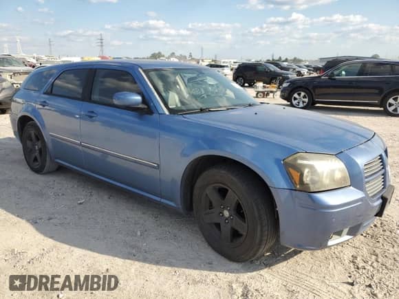 2007 Dodge Magnum with VIN 2D4FV47V57H836089, listed as a Copart auction lot 74497174 with 203,809 mi miles and Salvage title. Bid and sale history available at DreamBid. Image 4.