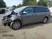 2016 Toyota Sienna LE with VIN 5TDJK3DC5GS144851, listed as a Copart auction lot 85482275 with 173,267 mi miles and Salvage title. Bid and sale history available at DreamBid. Image 1.