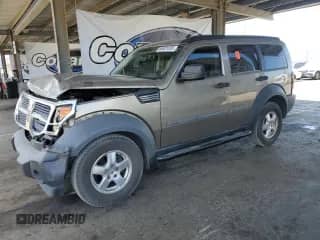 2007 Dodge Nitro SXT with VIN 1D8GT28K57W596531, listed as a Copart auction lot 66501035 with 163,914 mi miles and Salvage title. Bid and sale history available at DreamBid. Image 1.