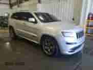 2012 Jeep Grand Cherokee SRT-8 z VIN 1C4RJFDJ2CC105829, wystawiony jako Copart lot #51840385 z przebiegiem 142 146 mil mil oraz Czysty tytuł • Clean title. Historia ofert i sprzedaży dostępna na DreamBid. Obrazek 4.