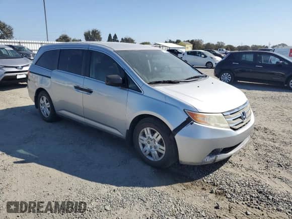 2011 Honda Odyssey LX with VIN 5FNRL5H26BB054988, listed as a Copart auction lot 72014505 with 179,855 mi miles and Salvage title. Bid and sale history available at DreamBid. Image 4.