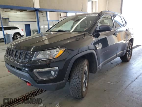 2017 Jeep Compass Trailhawk with VIN 3C4NJDDBXHT647011, listed as a Copart auction lot 65583185 with 106,438 mi miles and Salvage title. Bid and sale history available at DreamBid. Image 1.