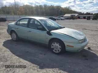 1997 Saturn SL with VIN 1G8ZK5274VZ271990, listed as a Copart auction lot 87279155 with 147,825 mi miles and Salvage title. Bid and sale history available at DreamBid. Image 4.