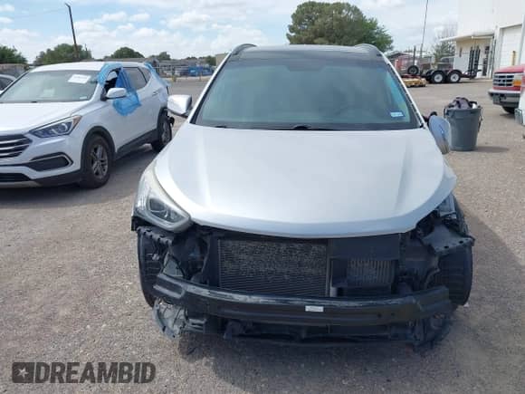 2016 Hyundai Santa Fe z VIN 5XYZW4LA5GG317357, wystawiony jako IAAI lot #42573155 z przebiegiem 103 382 mil mil oraz . Historia ofert i sprzedaży dostępna na DreamBid. Obrazek 12.