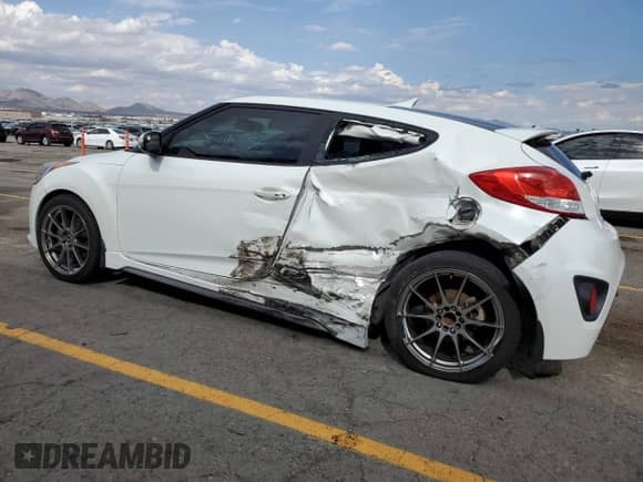 2014 Hyundai Veloster Turbo R-Spec с VIN KMHTC6AE1EU208532, выставлен на аукционе Copart как лот 70159995 с пробегом 75 844 миль миль и Списание • Salvage title. История ставок и продаж доступна на DreamBid. Изображение 2.