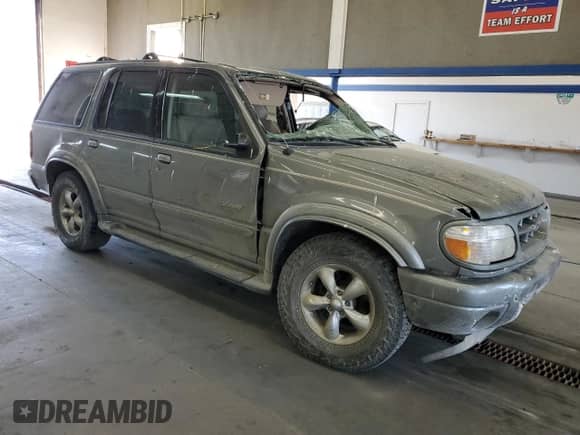 2000 Ford Explorer Limited with VIN 1FMDU75EXYZA41631, listed as a Copart auction lot 63808935 with 221,084 mi miles and Salvage title. Bid and sale history available at DreamBid. Image 4.
