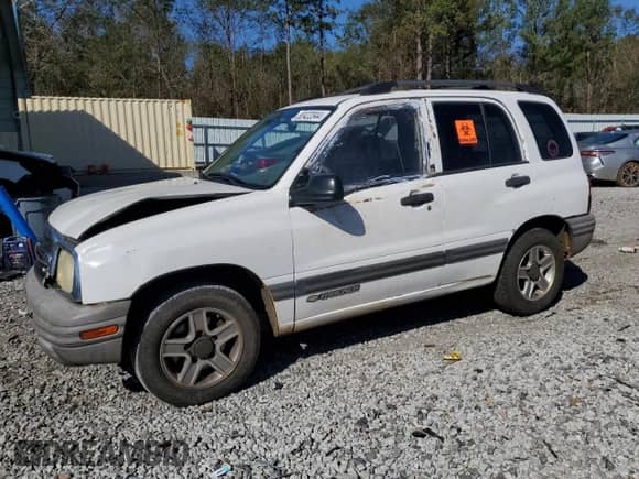 2003 Chevrolet Tracker z VIN 2CNBE13C736912038, wystawiony jako Copart lot #80422844 z przebiegiem 242 512 mil mil oraz Szkoda całkowita • Salvage title. Historia ofert i sprzedaży dostępna na DreamBid. Obrazek 1.