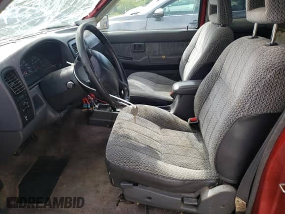 1996 Nissan Frontier XE with VIN 1N6SD16S8TC335129, listed as a Copart auction lot 55884495 with 313,757 mi miles and Salvage title. Bid and sale history available at DreamBid. Image 7.