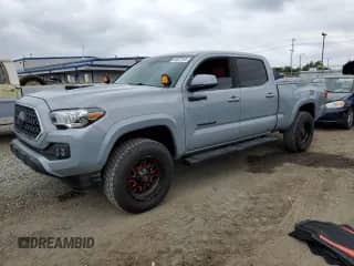 2019 Toyota Tacoma SR5 with VIN 3TMBZ5DN0KM022291, listed as a Copart auction lot 56037105 with 77,728 mi miles and Salvage title. Bid and sale history available at DreamBid. Image 1.