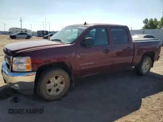 2013 Chevrolet Silverado 1500 LT with VIN 3GCPKSE77DG238973, listed as a Copart auction lot 80338935 with 104,219 mi miles and Salvage title. Bid and sale history available at DreamBid. Image 1.