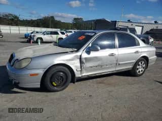 2003 Hyundai Sonata with VIN KMHWF25HX3A868844, listed as a Copart auction lot 81922105 with 513,136 mi miles and Salvage title. Bid and sale history available at DreamBid. Image 1.