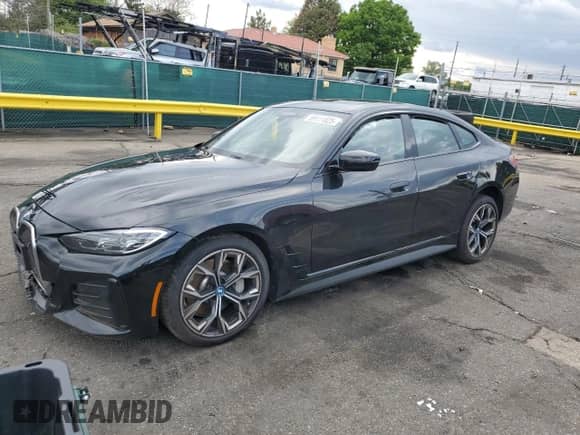2024 BMW i4 xDrive40 with VIN WBY83FB09RFS54860, listed as a Copart auction lot 59111825 with 12,006 mi miles and Salvage title. Bid and sale history available at DreamBid. Image 1.