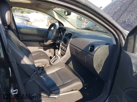 2011 Dodge Caliber Uptown with VIN 1B3CB9HB2BD172349, listed as a IAAI auction lot 42901430 with 141,201 mi miles and . Bid and sale history available at DreamBid. Image 5.