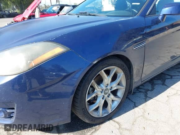 2007 Hyundai Tiburon GT с VIN KMHHN66F47U250875, выставлен на аукционе IAAI как лот 41999150 с пробегом 65 401 миль миль и . История ставок и продаж доступна на DreamBid. Изображение 13.