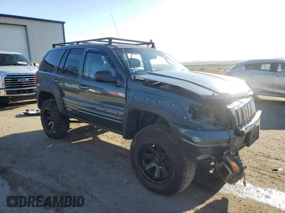2002 Jeep Grand Cherokee Overland с VIN 1J8GW68J32C323210, выставлен на аукционе Copart как лот 54000555 с пробегом 104 373 миль миль и Списание • Salvage title. История ставок и продаж доступна на DreamBid. Изображение 4.