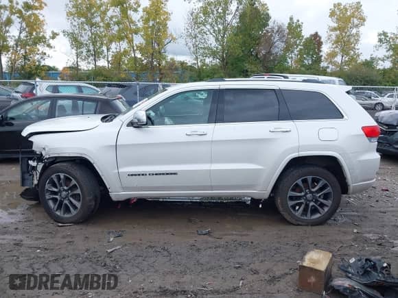 2018 Jeep Grand Cherokee Overland with VIN 1C4RJFCG1JC405736, listed as a IAAI auction lot 43296562 with 91,589 mi miles and . Bid and sale history available at DreamBid. Image 14.