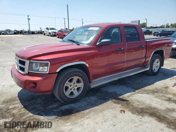 2009 Dodge Dakota SXT with VIN 1D7HE38K89S782681, listed as a Copart auction lot 67996815 with 143,865 mi miles and Salvage title. Bid and sale history available at DreamBid. Image 1.