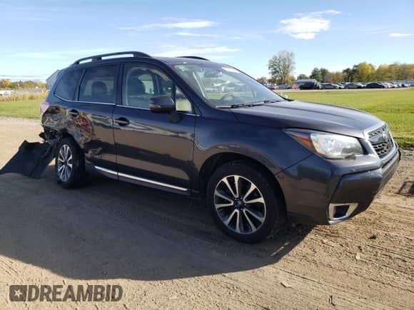 2017 Subaru Forester Touring z VIN JF2SJGWCXHH543032, wystawiony jako Copart lot #82477415 z przebiegiem 154 499 mil mil oraz Szkoda całkowita • Salvage title. Historia ofert i sprzedaży dostępna na DreamBid. Obrazek 4.